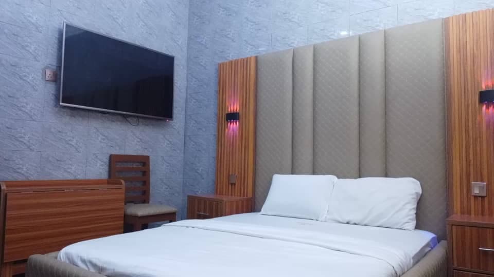 Premium Deluxe Room with a reading corner and floor lamp